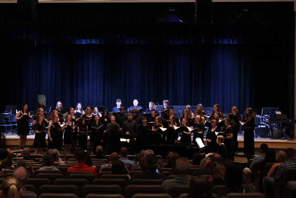 choir members singing on risers