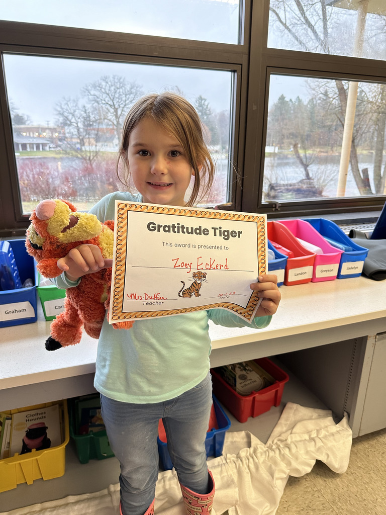 girl holding tiger and paper