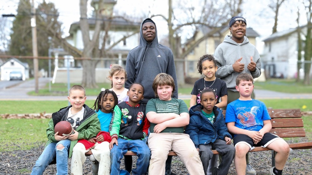 students posing on bench