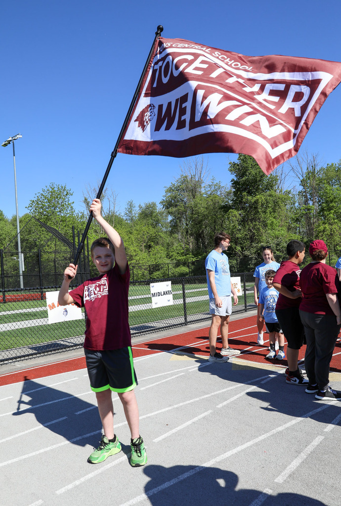 student with special olypics flag
