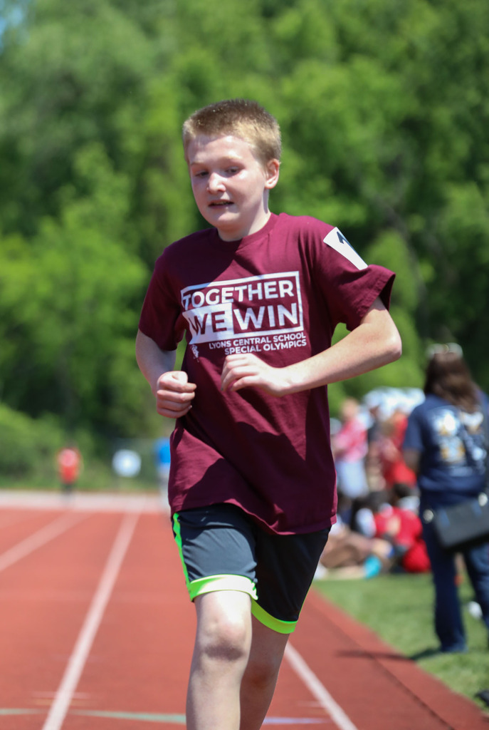 student running on track