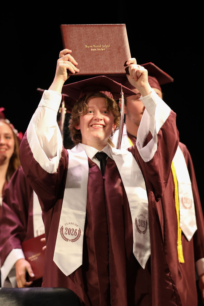 senior with diploma