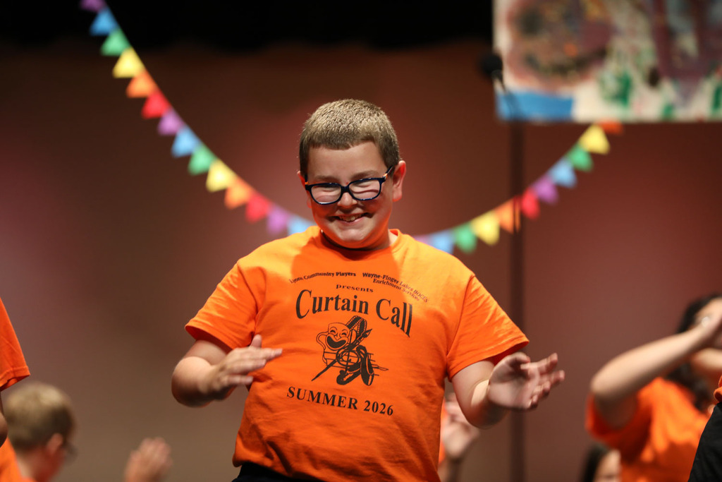 student smiling and dancing