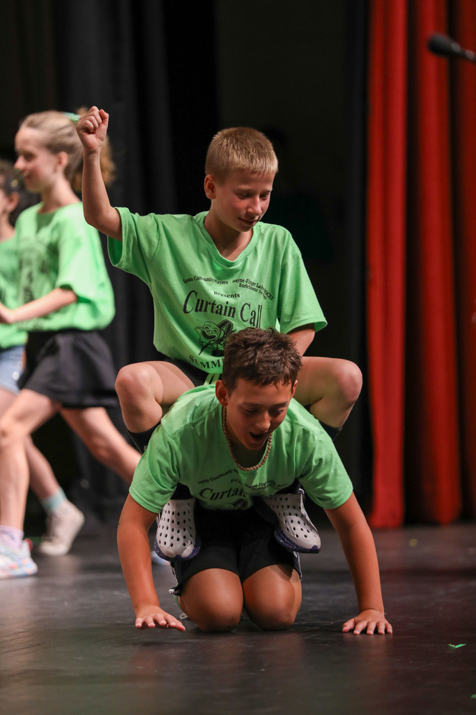 students acting on stage