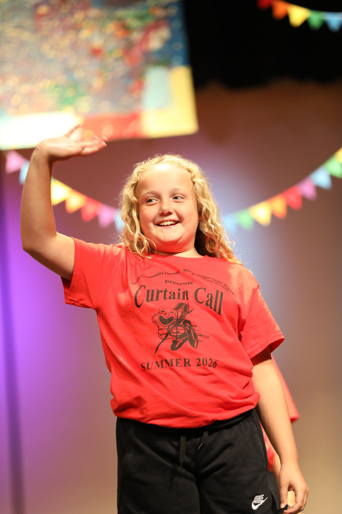 student waving