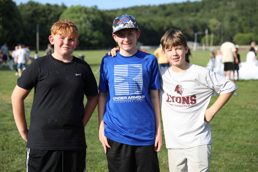 three boys smiling