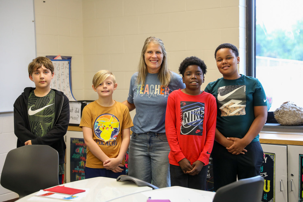 6th graders with their teacher