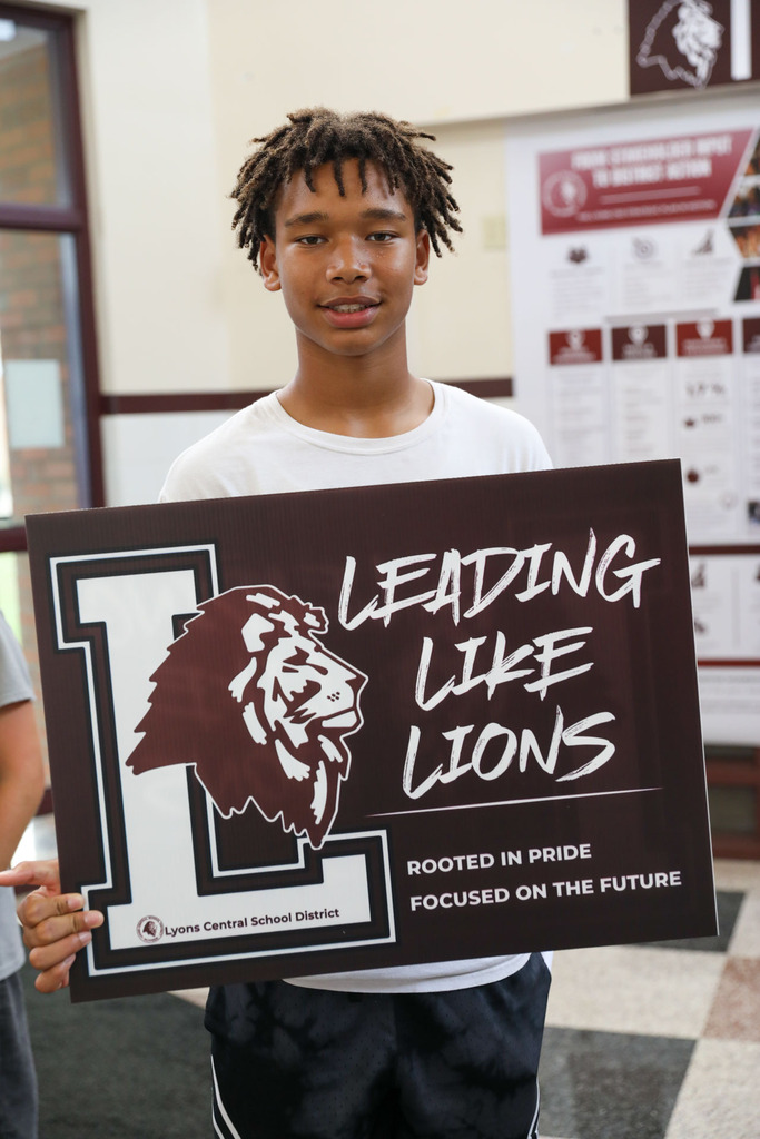 student with sign