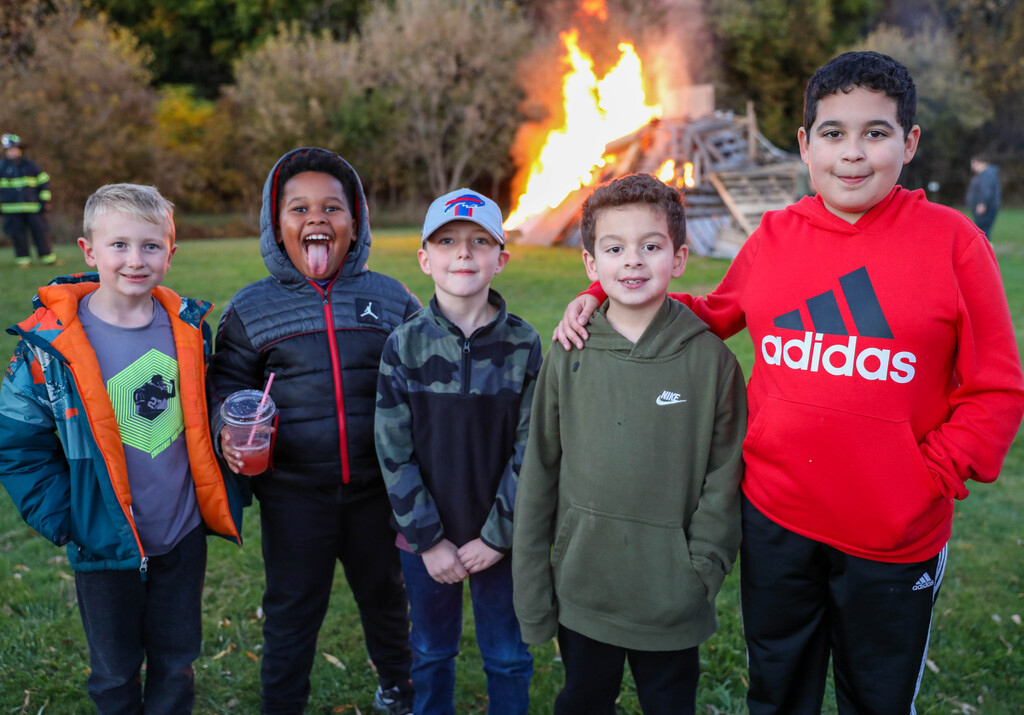 students in front of bon fire