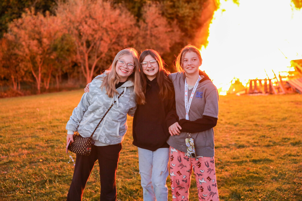 students in front of bon fire