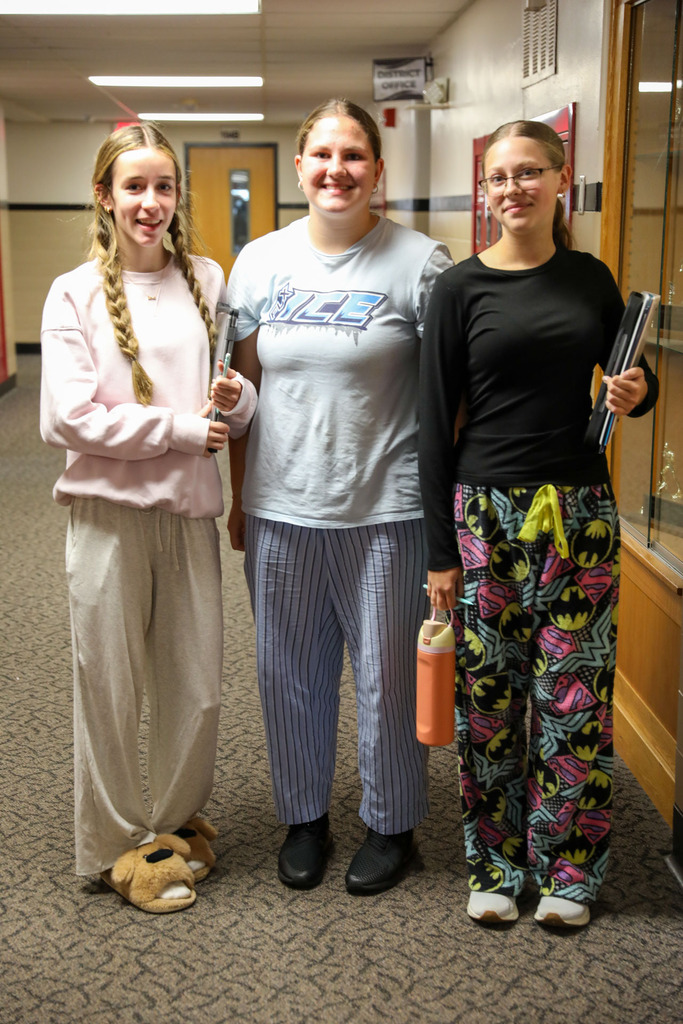 students in hallway in pajamas