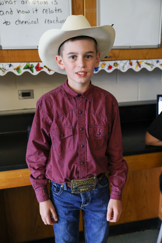 student in cowboy hat