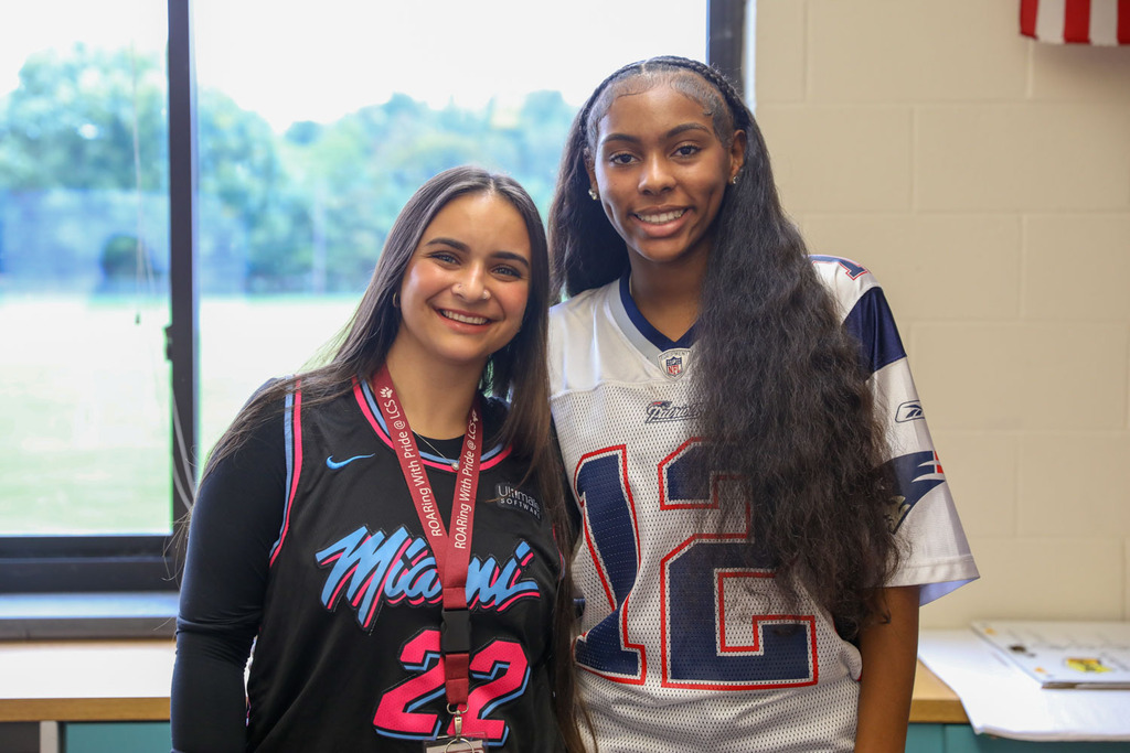 teacher with student in jersey