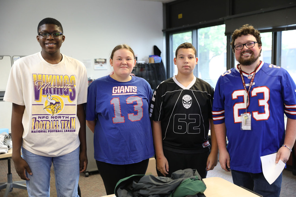 students with teacher in classroom