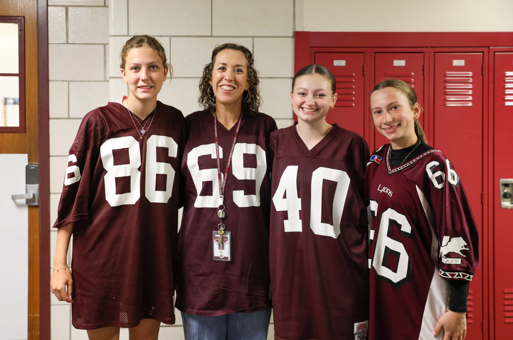 teacher with students in hallway