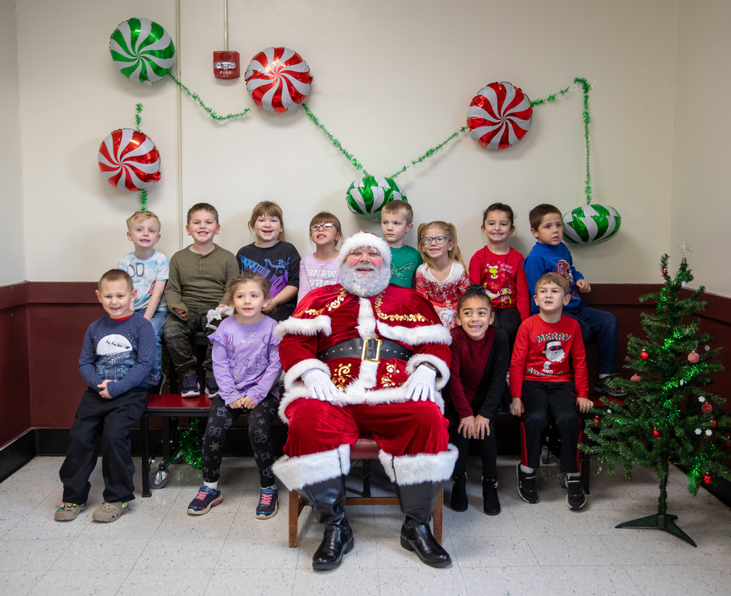 kids sitting with Santa