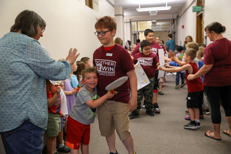 students giving hugs