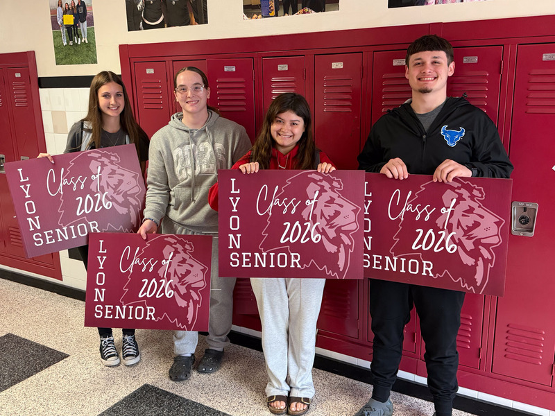 seniors with their signs