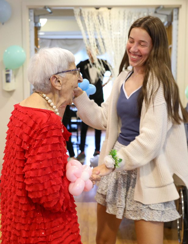 student dancing with resident