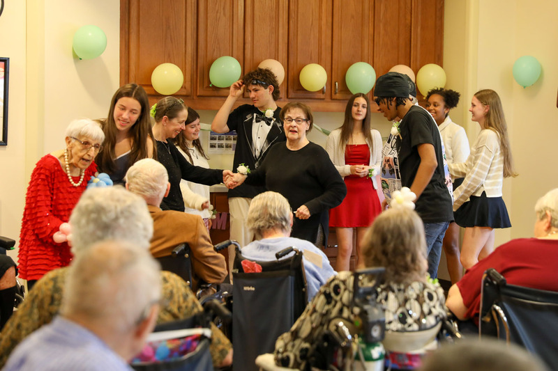 students and residents dancing