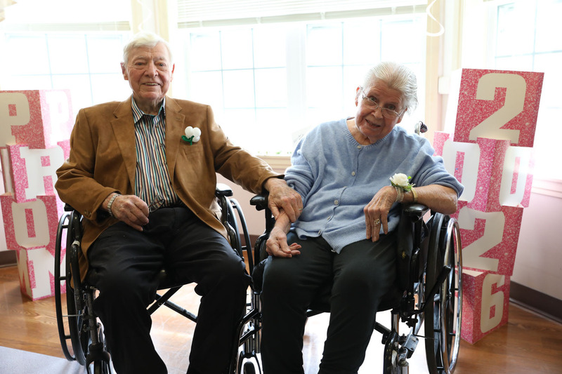 residents posing at prom