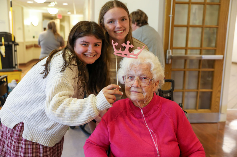 students posing with resident