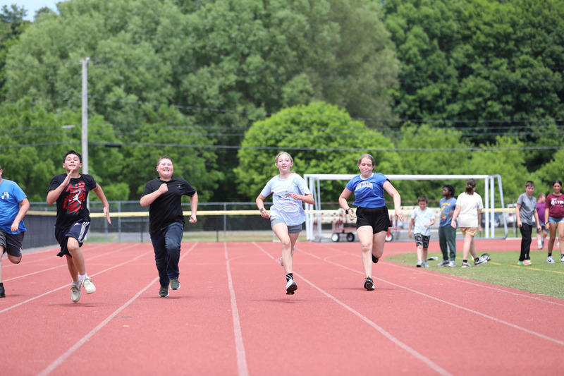 students running on track