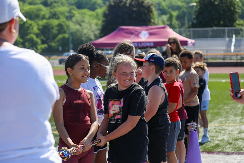 students smiling on field