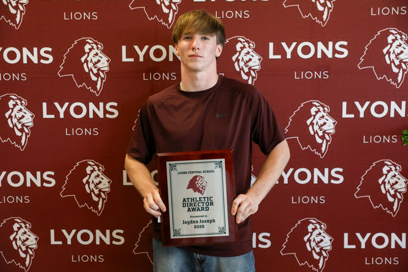 athlete with his award
