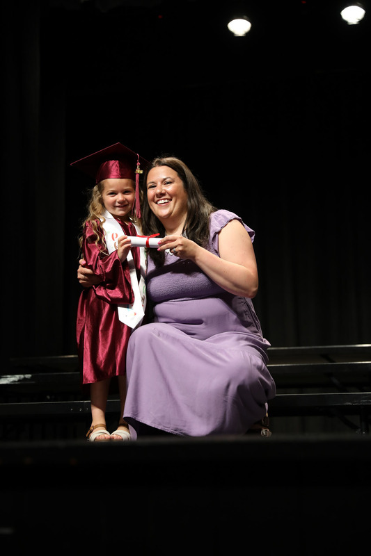 student getting diploma
