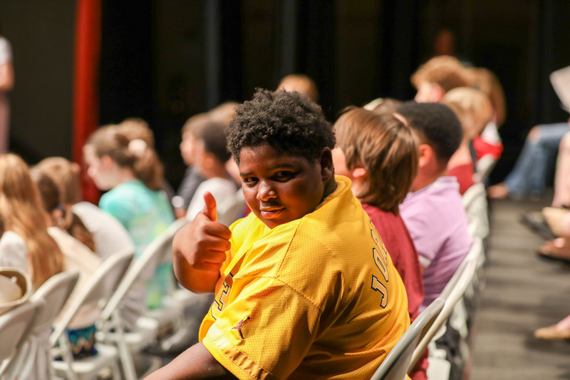 boy posing at 5th grade grad