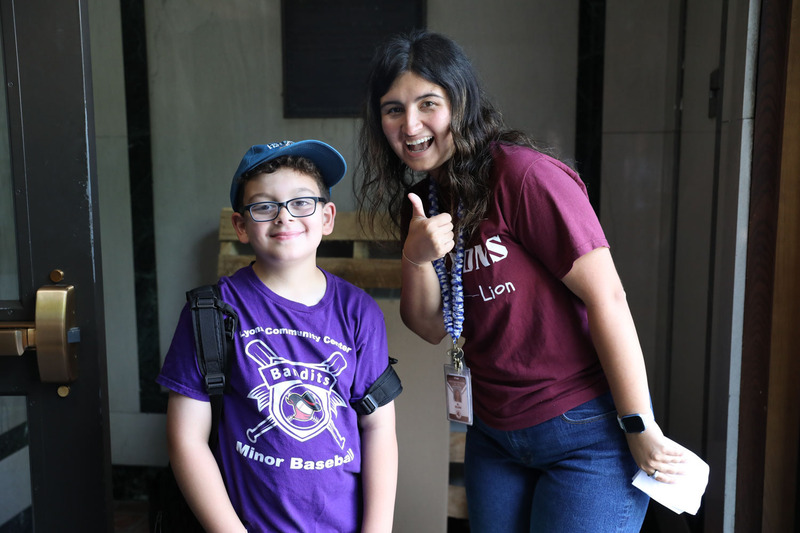 student and teacher smiling