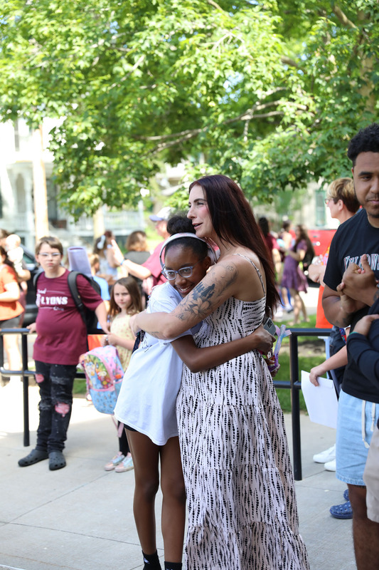 nurse and student hugs