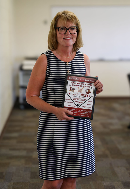 Mary Britt with plaque