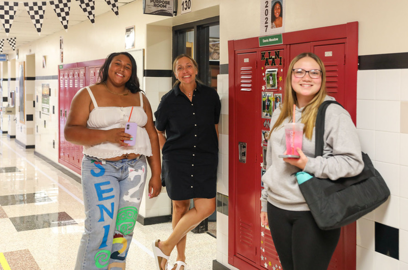 seniors and staff in hallway