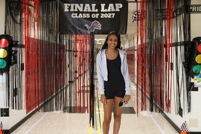 senior in front of hallway