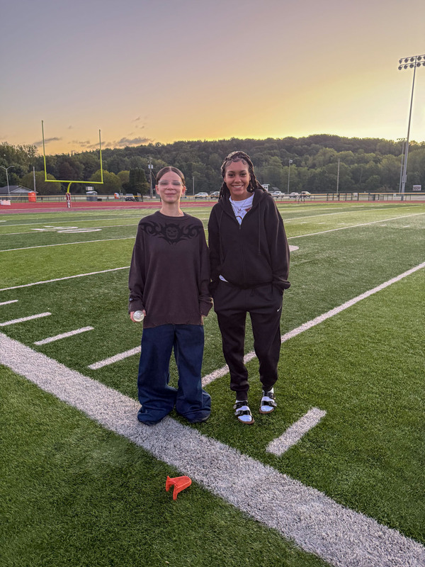 seniors standing on football field