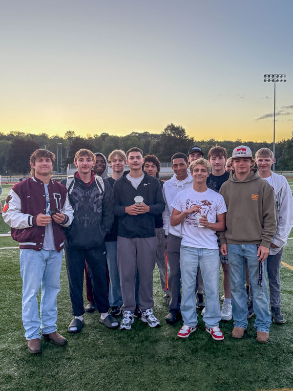 a group of boys on the football field posing