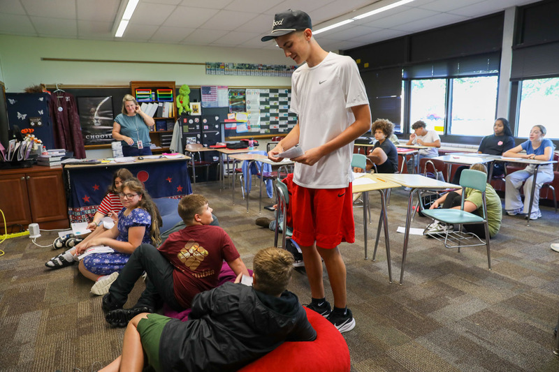 leadership student giving cards