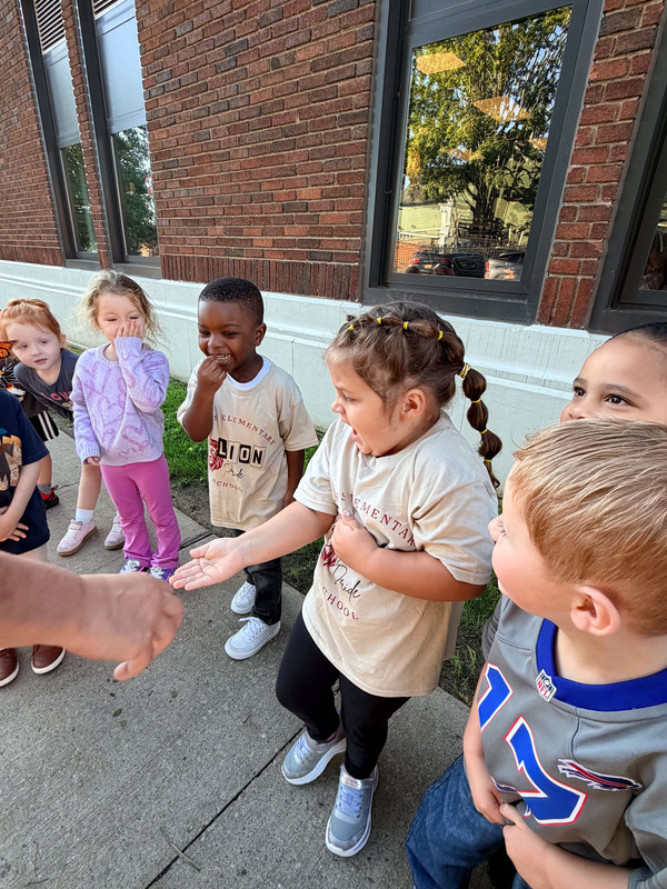 student releasing butterflies