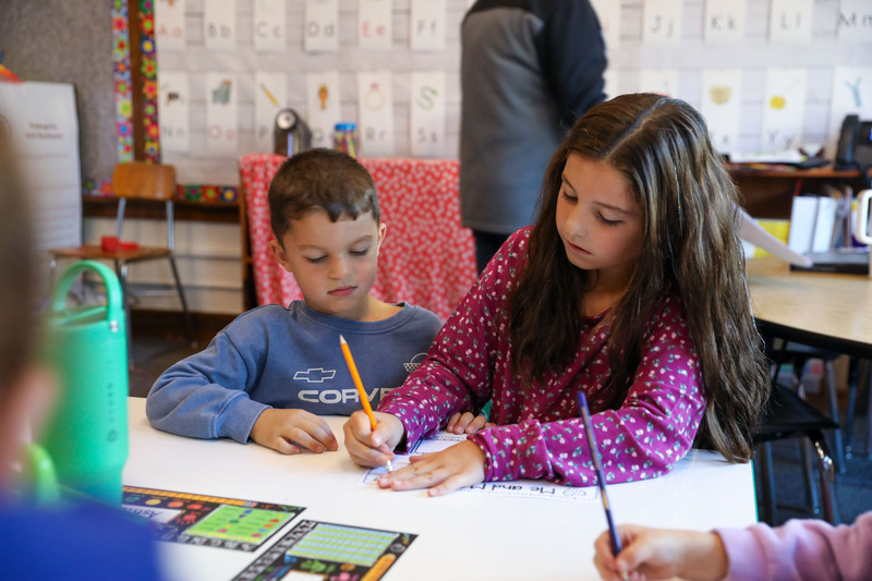 students mentoring younger students
