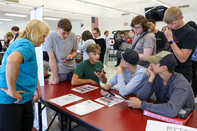 students working in cafeteria on project