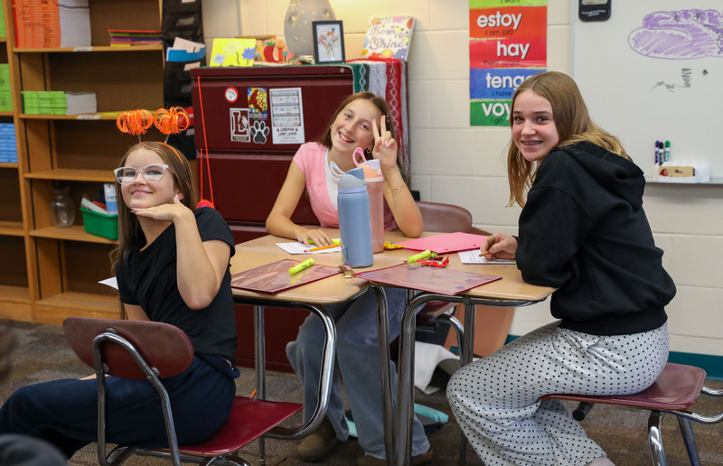 students posing in class
