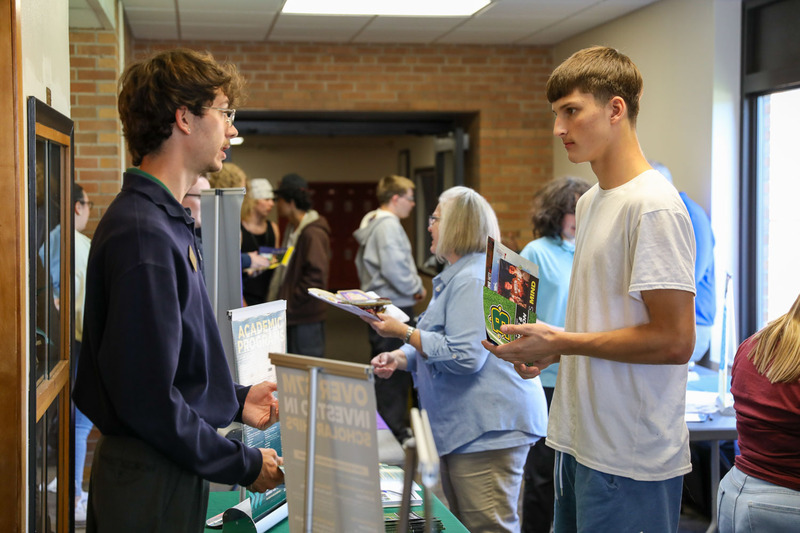 student talking to college rep