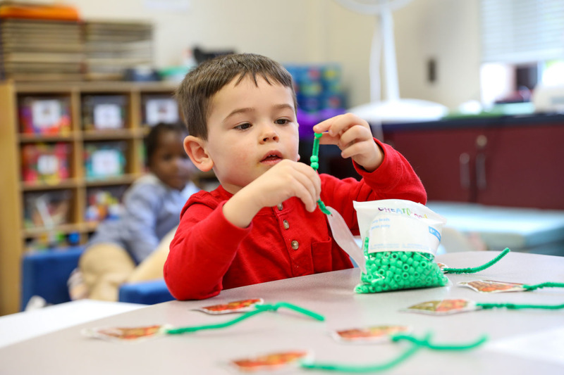 3upk student working on a craft