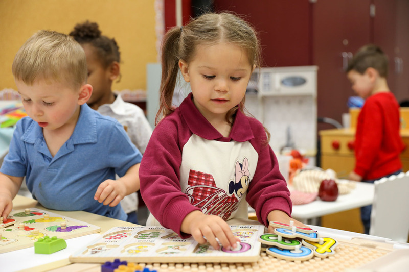 3upk student working on a puzzle