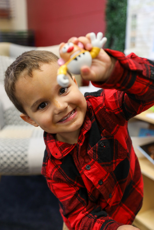 3upk student showing his mr. potato head