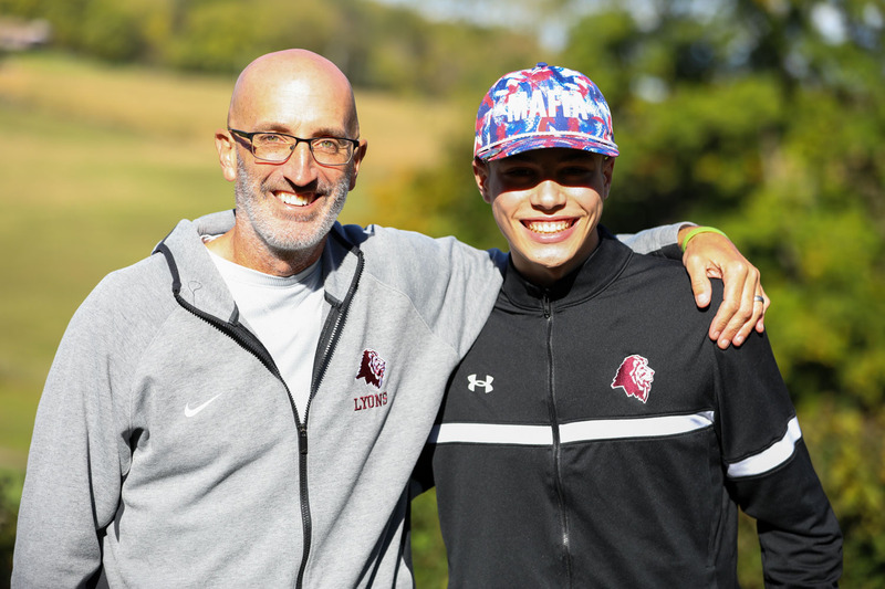 coach and golfer posing for picture