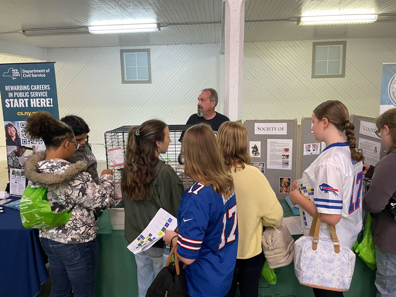 students getting more information at a career vendor booth