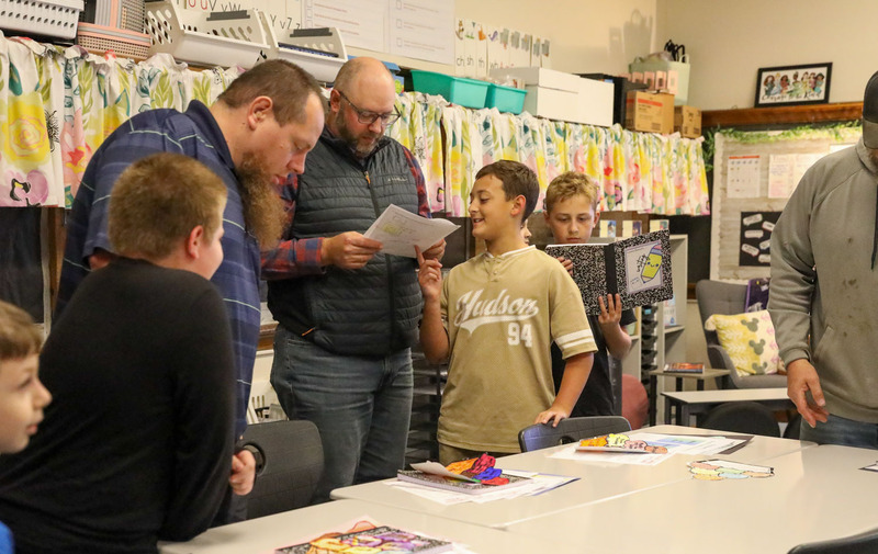 student showing parent their work